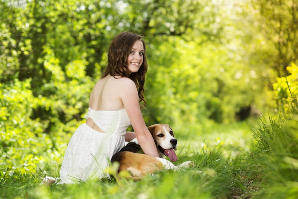 Portrait of a woman with her beautiful dog outdoors