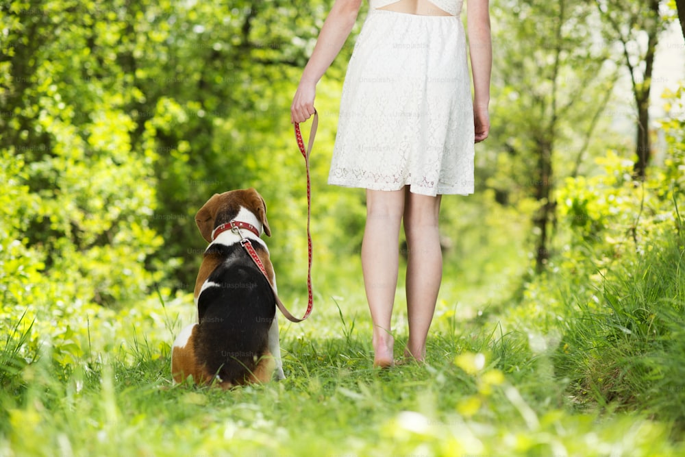 Portrait of a woman with her beautiful dog outdoors