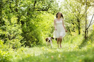 Portrait of a woman with her beautiful dog outdoors