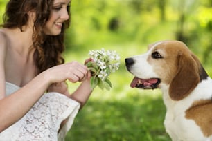 Portrait of a woman with her beautiful dog outdoors