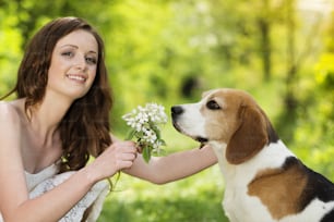 Portrait of a woman with her beautiful dog outdoors