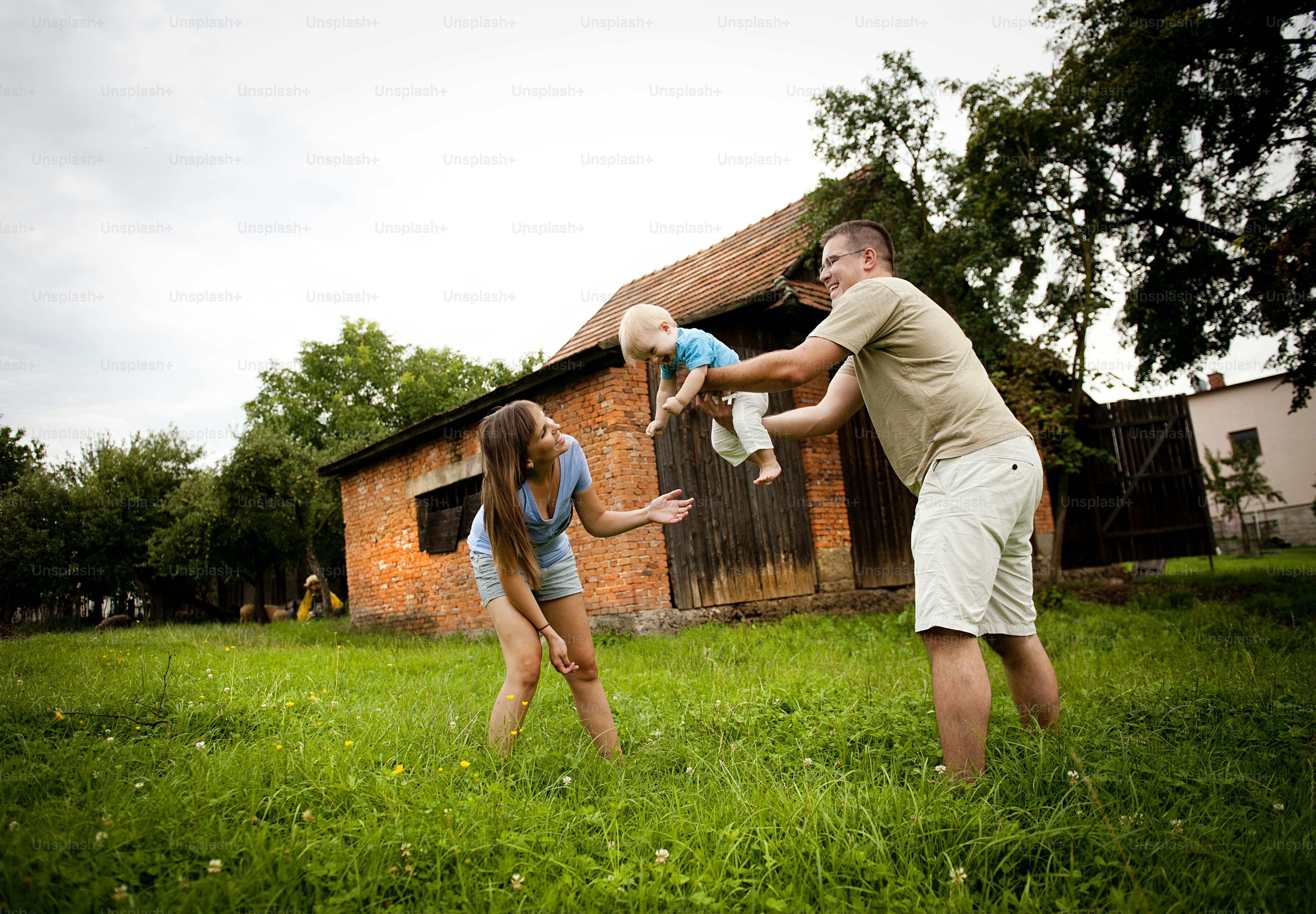 Young family is enjoying a day on the farm