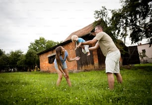 Young family is enjoying a day on the farm