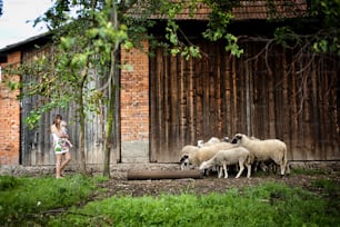 Young family is enjoying a day on the farm