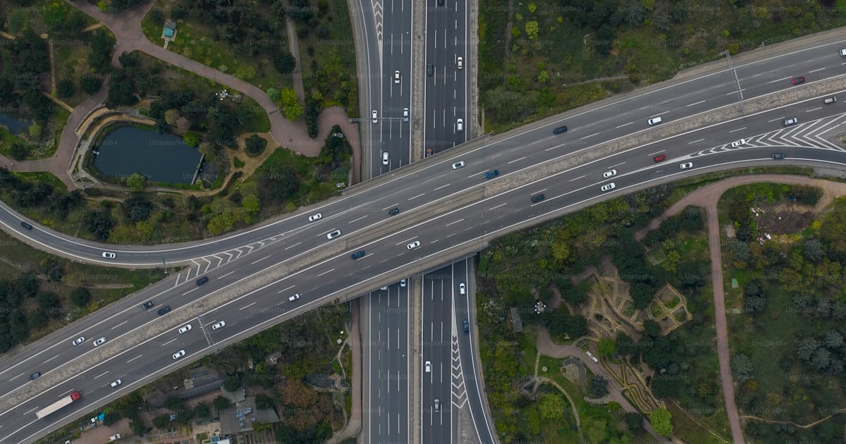 An aerial view of a highway intersection with multiple lanes photo ...