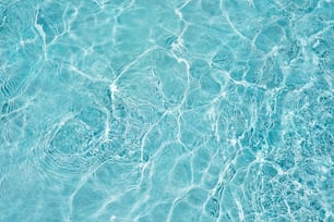 a blue pool with clear blue water