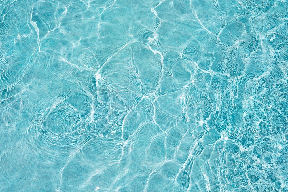 a blue pool with clear blue water