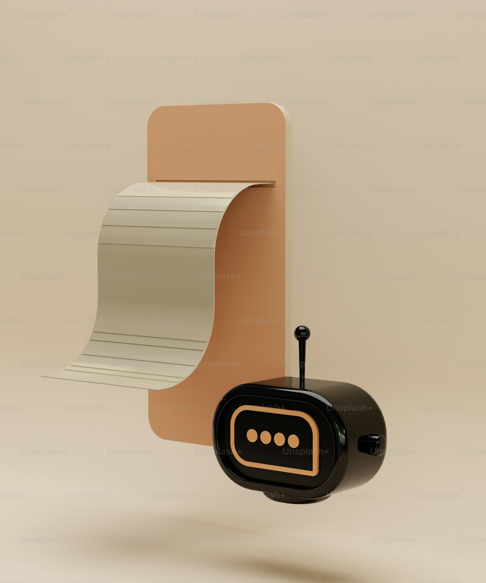 a black clock with a roll of paper hanging from it's side