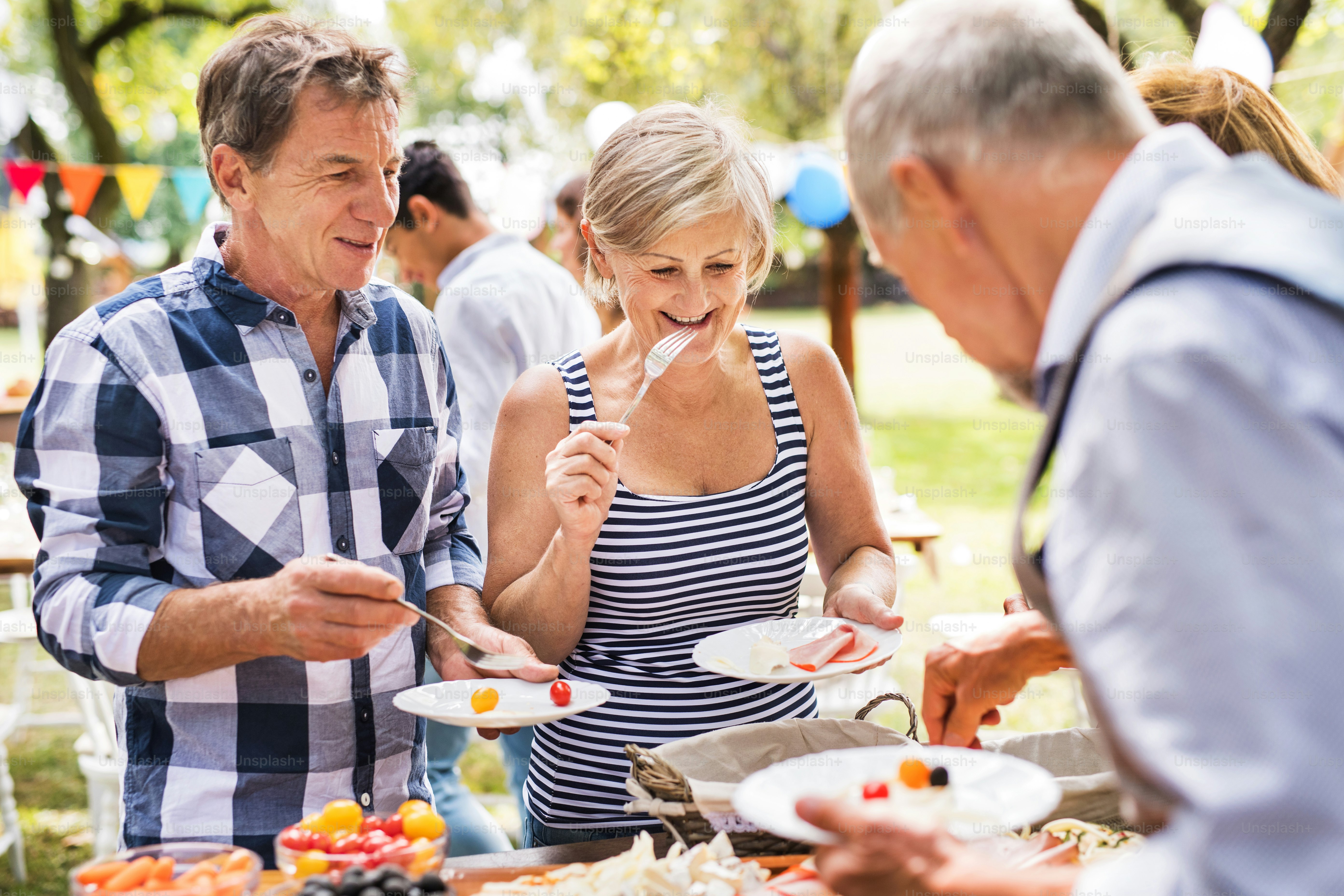 Family celebration outside in the backyard. Big garden party. photo ...