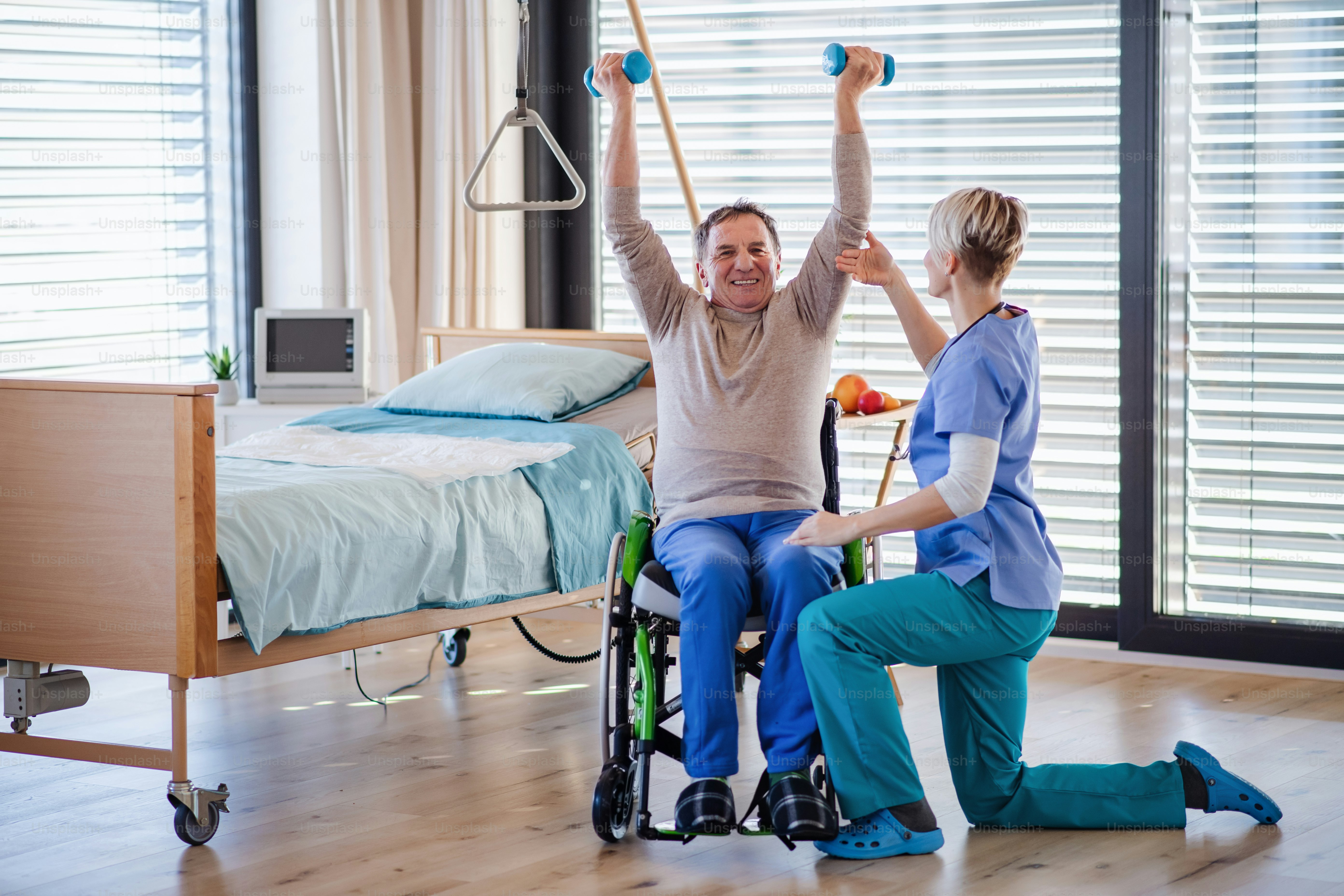 A healthcare worker and senior patient in hospital, physiotherapy concept.