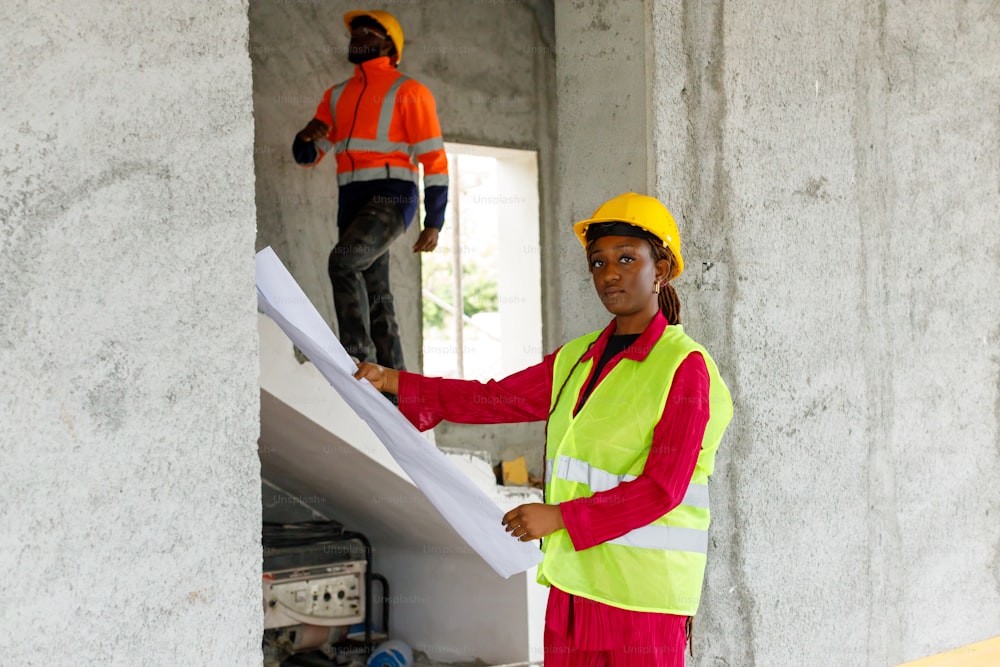 a woman in a safety vest holding a piece of paper