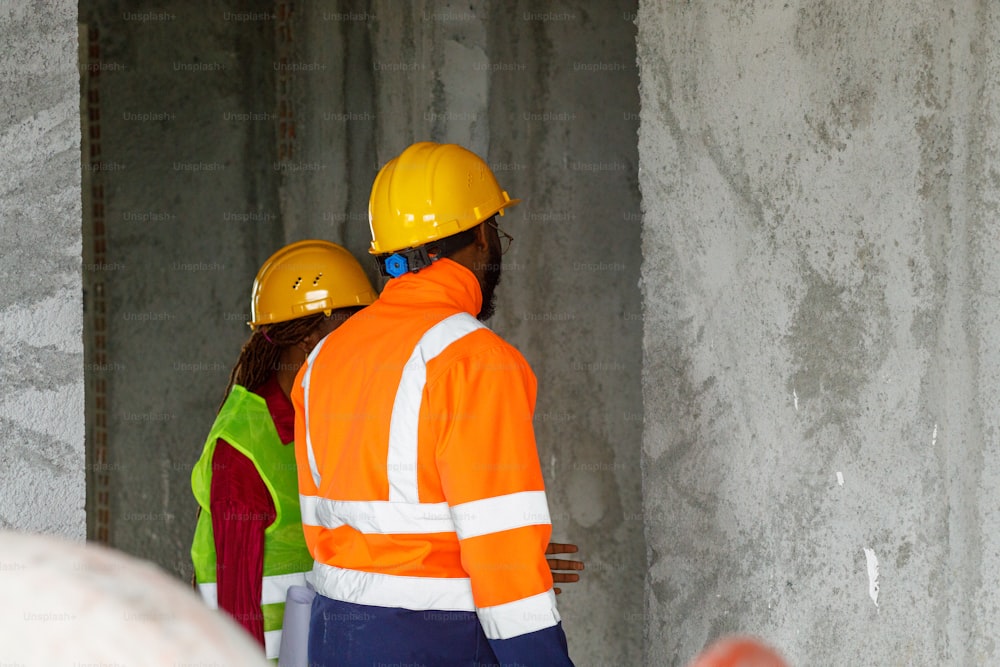 a group of construction workers standing next to each other