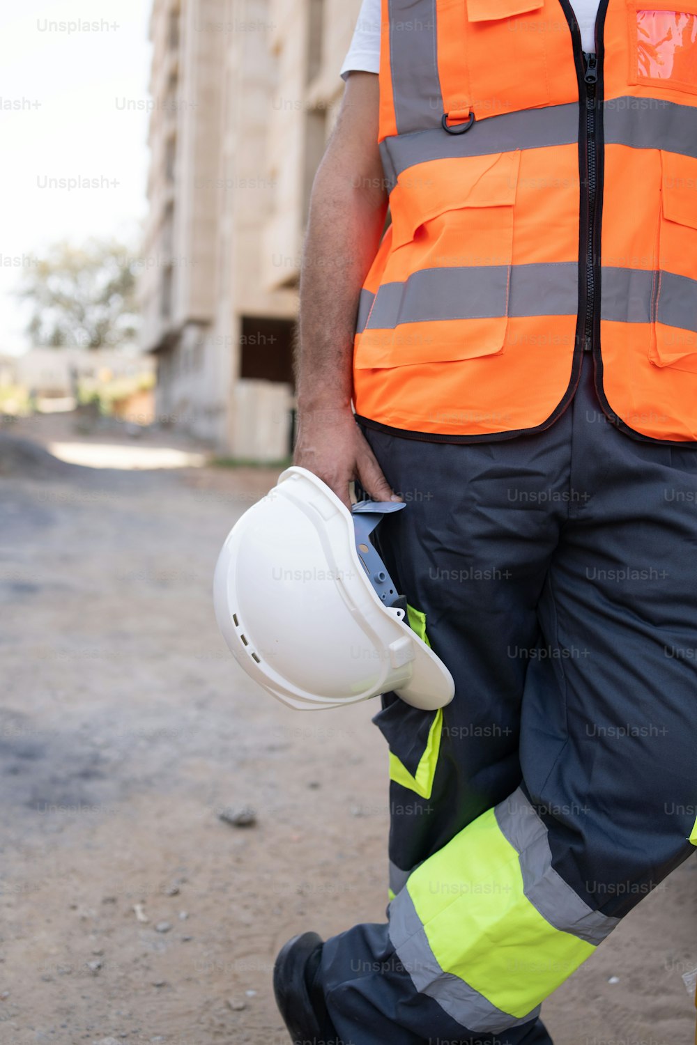 a man wearing a hard hat and safety vest