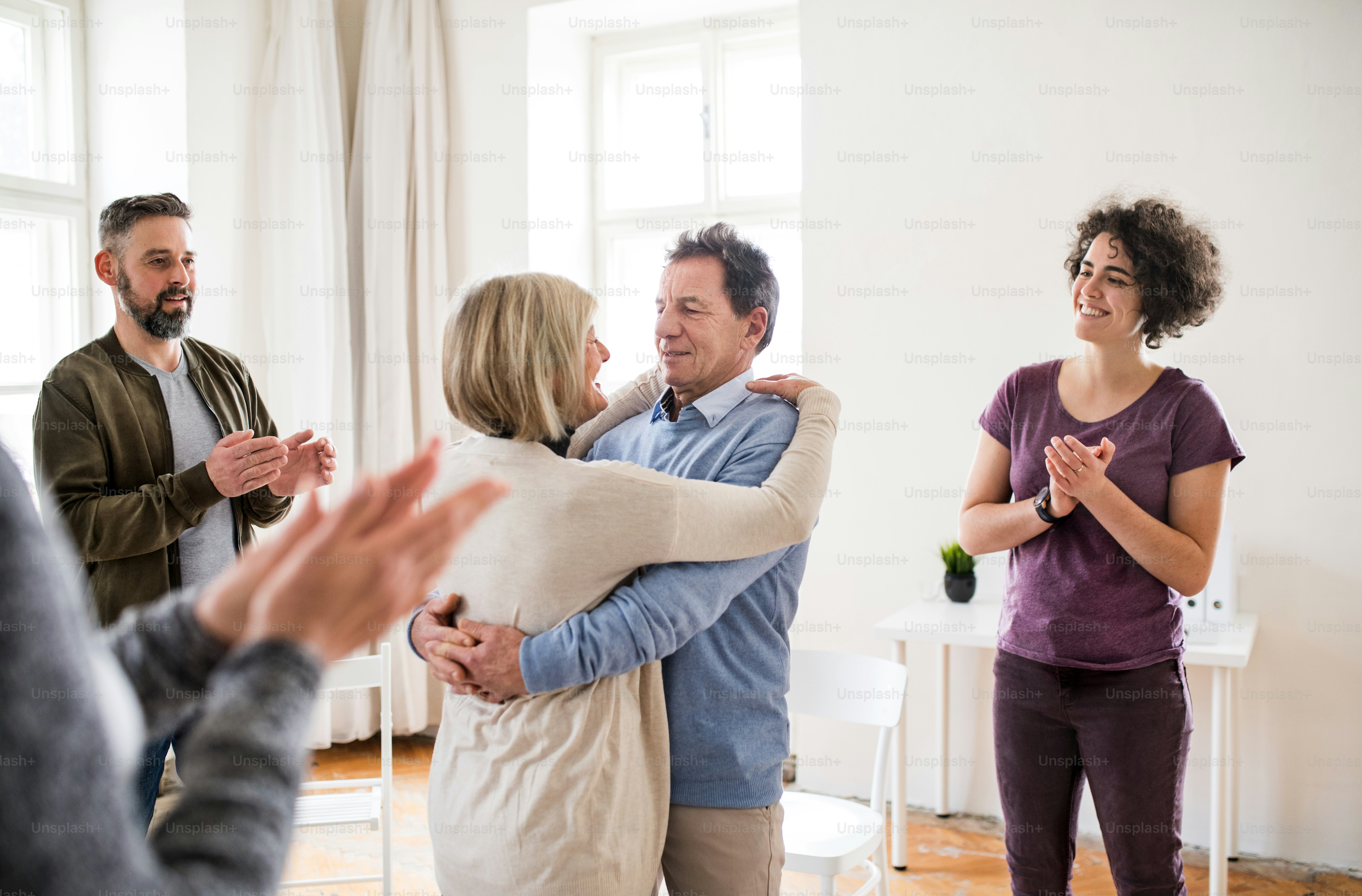 Support group discussing mental health and addiction challenges