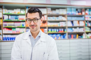 Portrait of a young atrractive friendly male pharmacist.