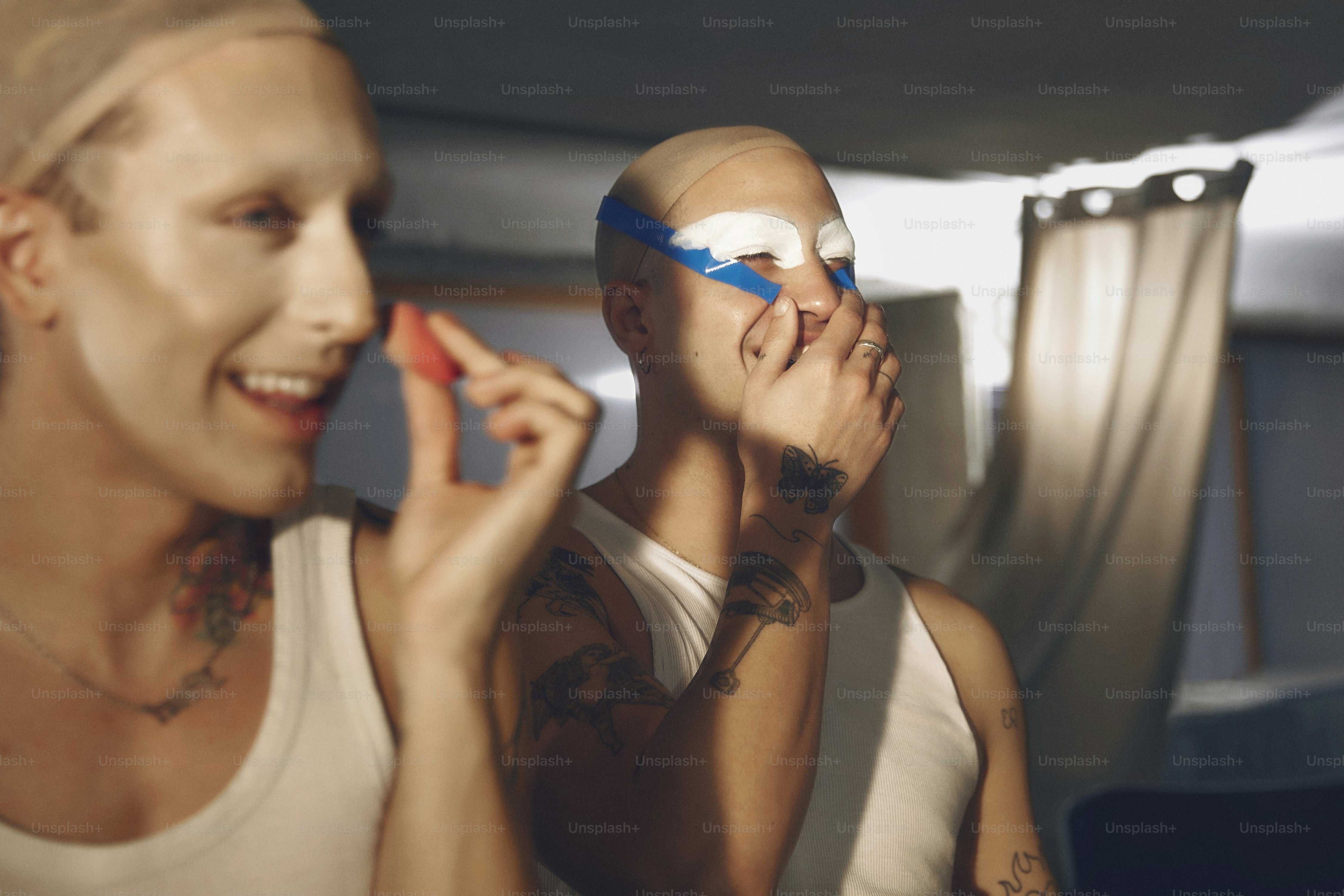 a man and a woman with their faces painted