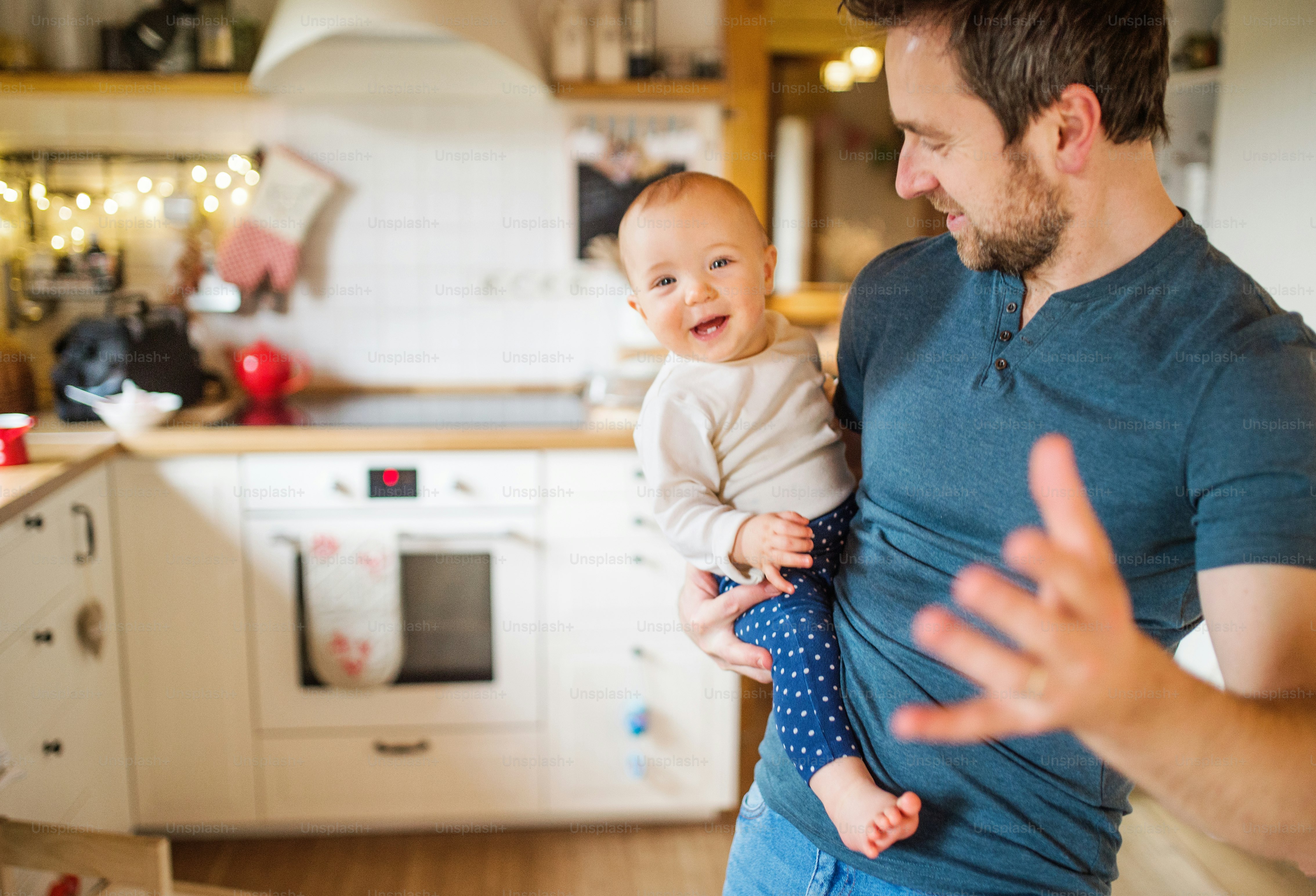 Father with two toddlers at home. First steps. Paternity leave. photo ...