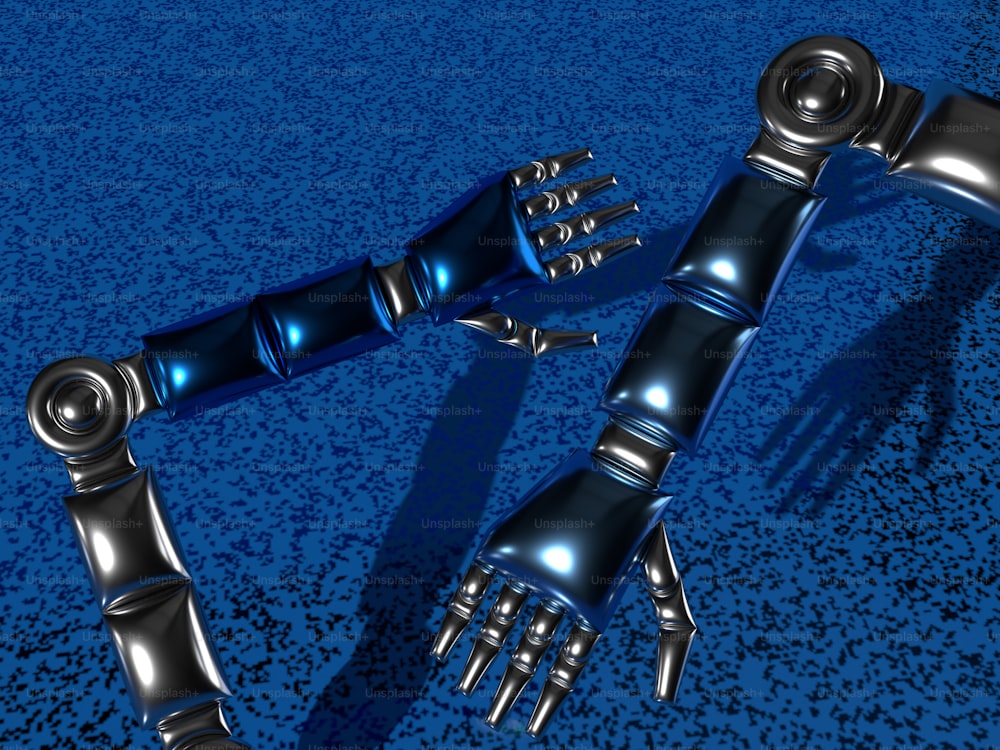 파란색 표면에 한 쌍의 로봇 손