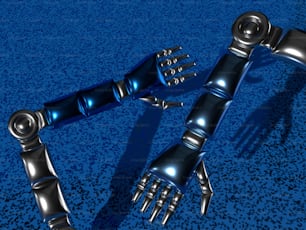 Un par de manos de robot sobre una superficie azul