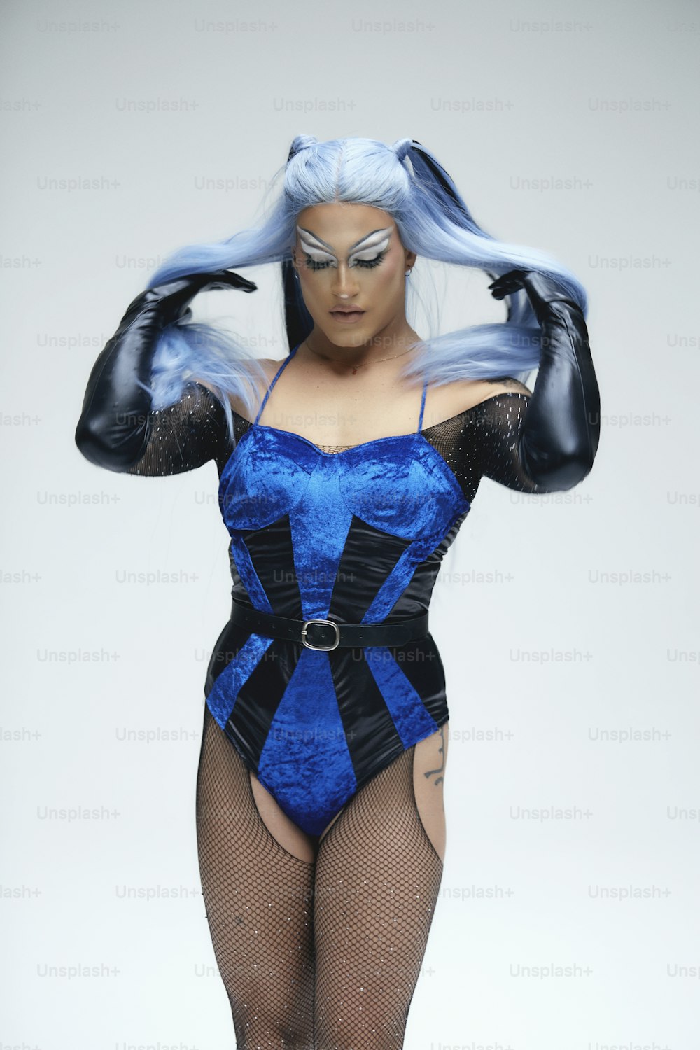 a woman in a blue and black corset