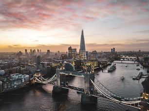 an aerial view of a city at sunset