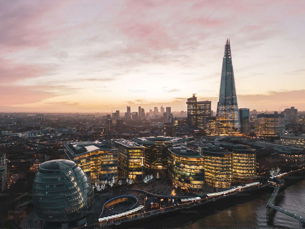 an aerial view of a city at dusk