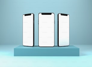 Tre telefoni cellulari seduti in cima a una piattaforma blu