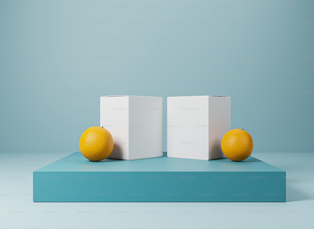 deux oranges assises au sommet d’une plate-forme bleue