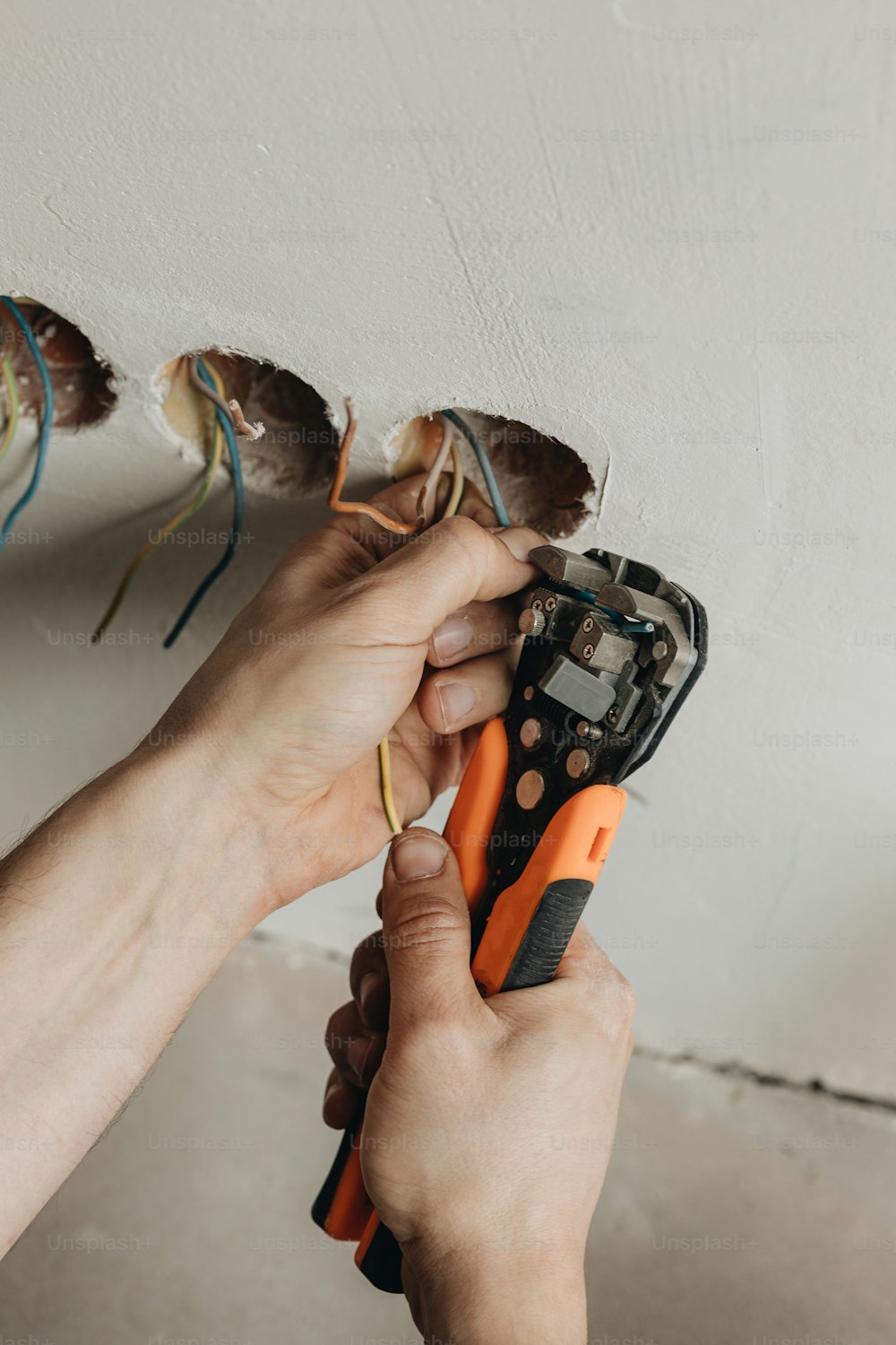 a person holding a pair of scissors in their hand