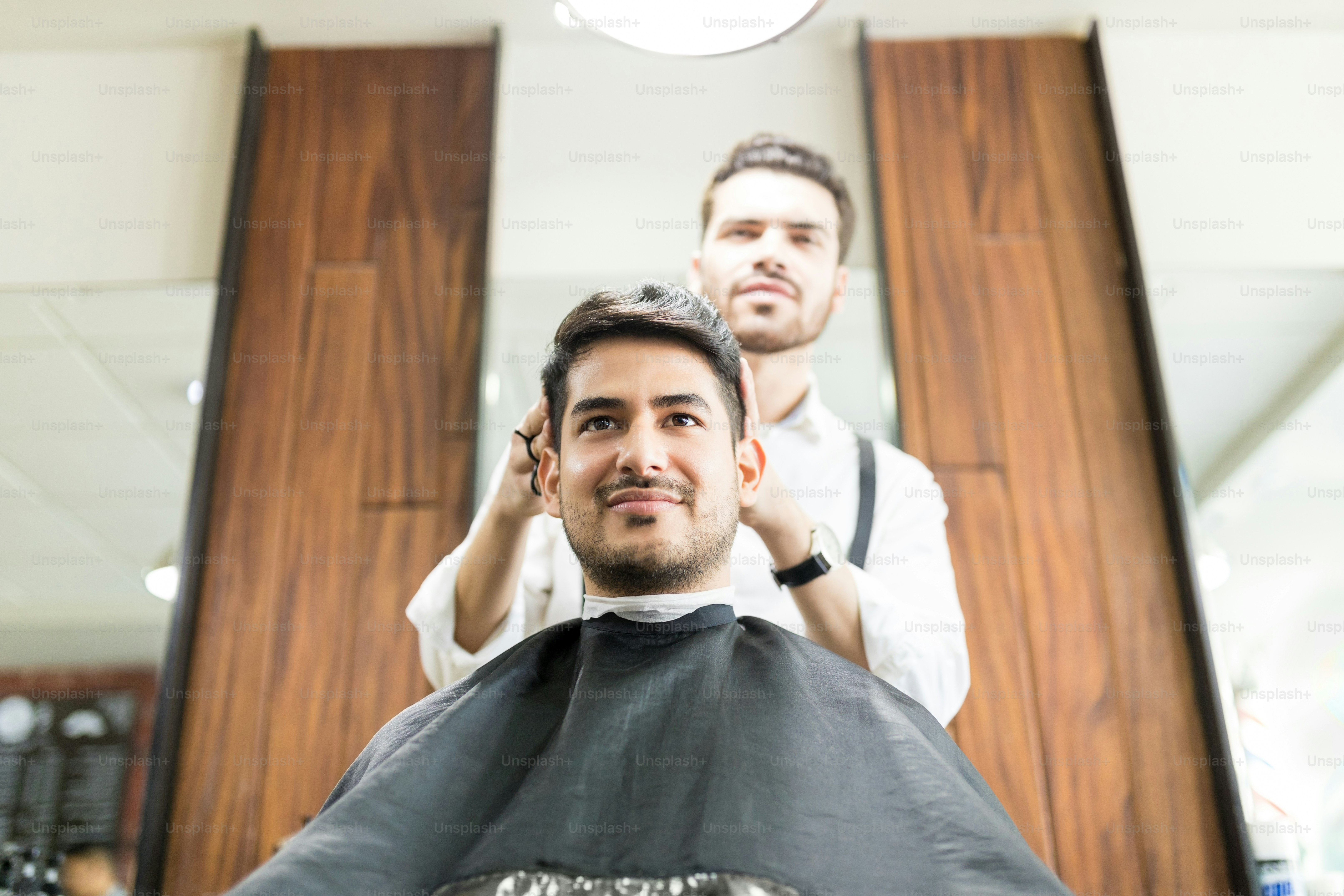 Client during beard and hair grooming in barber shop photo – Brazilian  ethnicity Image on Unsplash