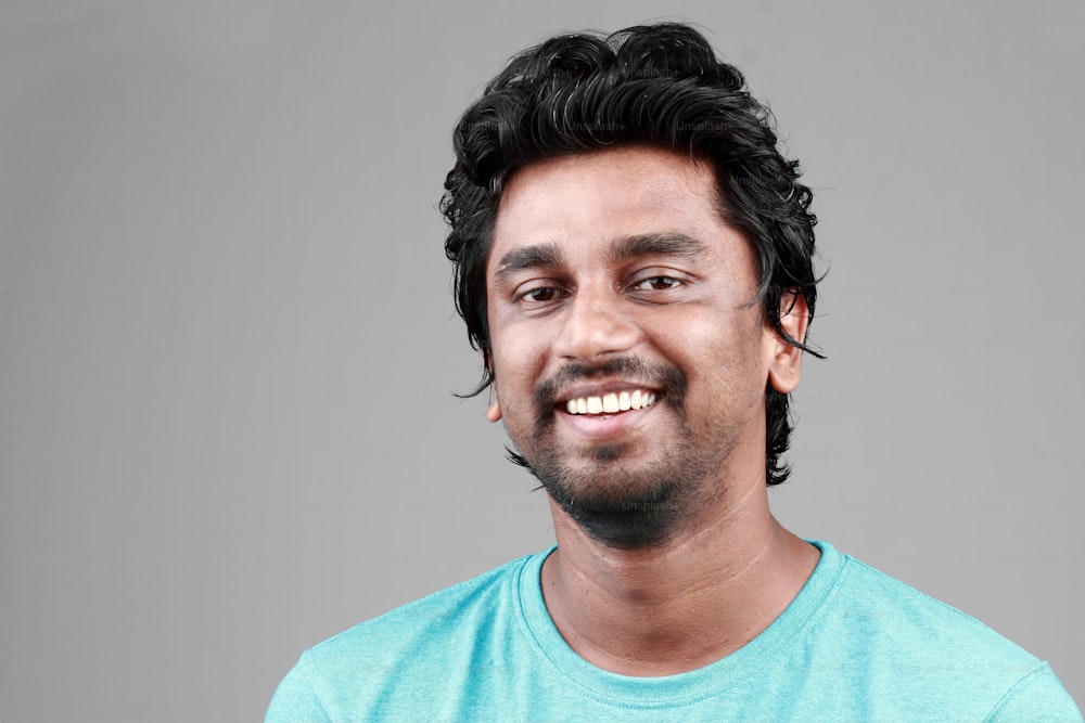 Portrait of a smiling young man of Indian origin