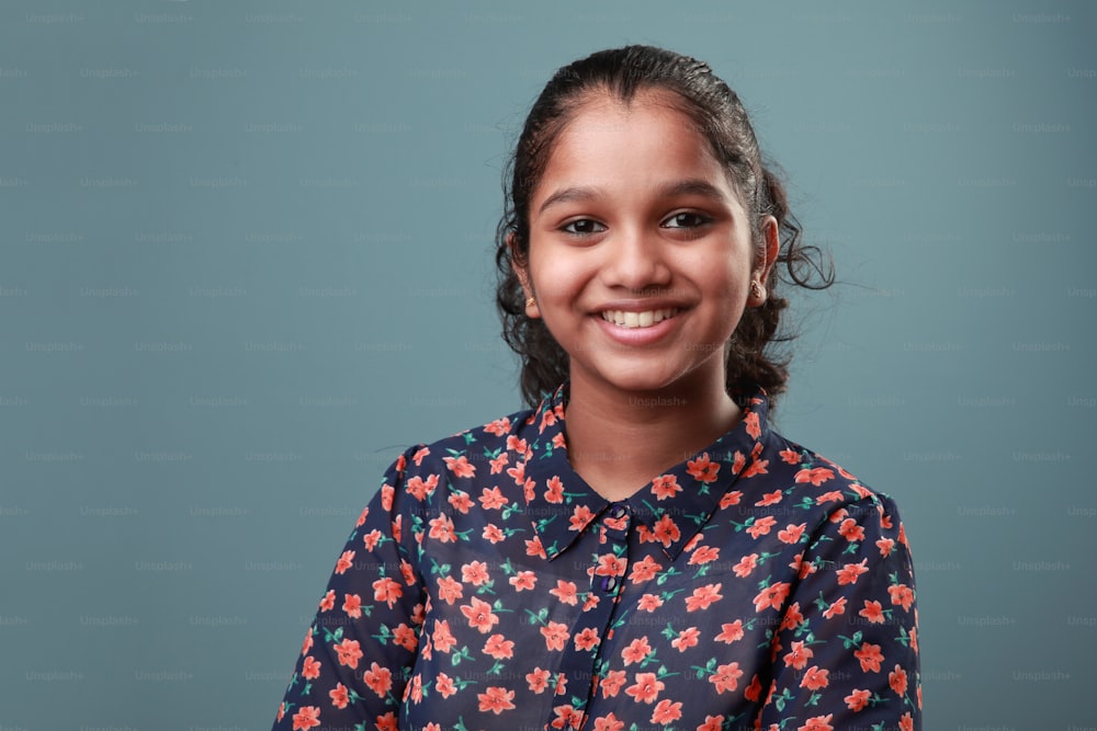 Portrait of a smiling young girl of Indian ethnicity