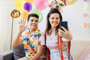 Brazilian Carnival. Mother and son celebrating carnival at home