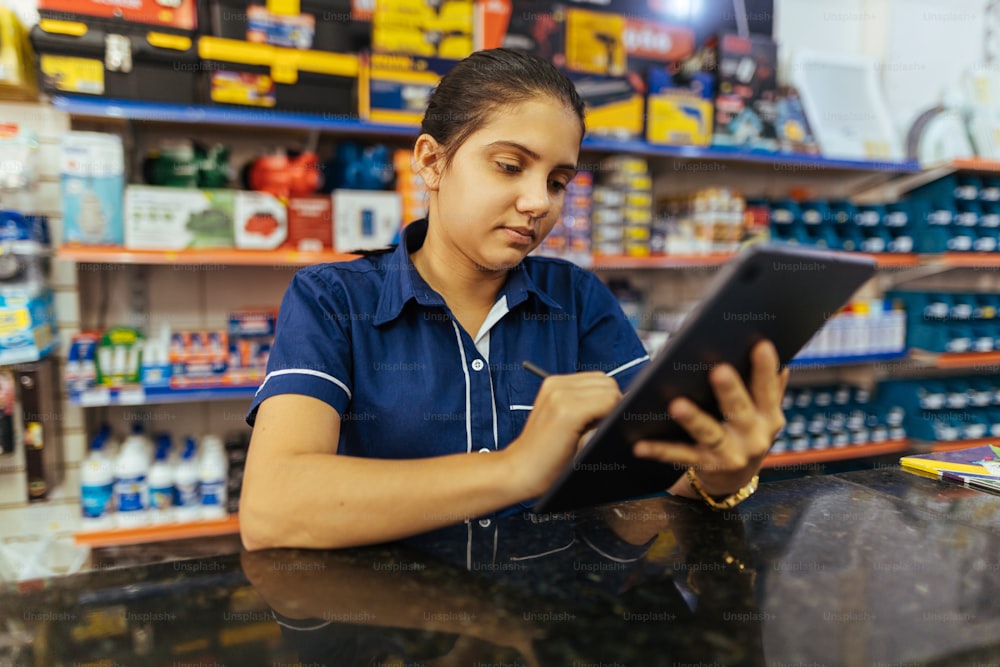 Young latin woman working in hardware store