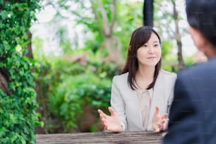 Businesswoman exchanging opinions outdoors