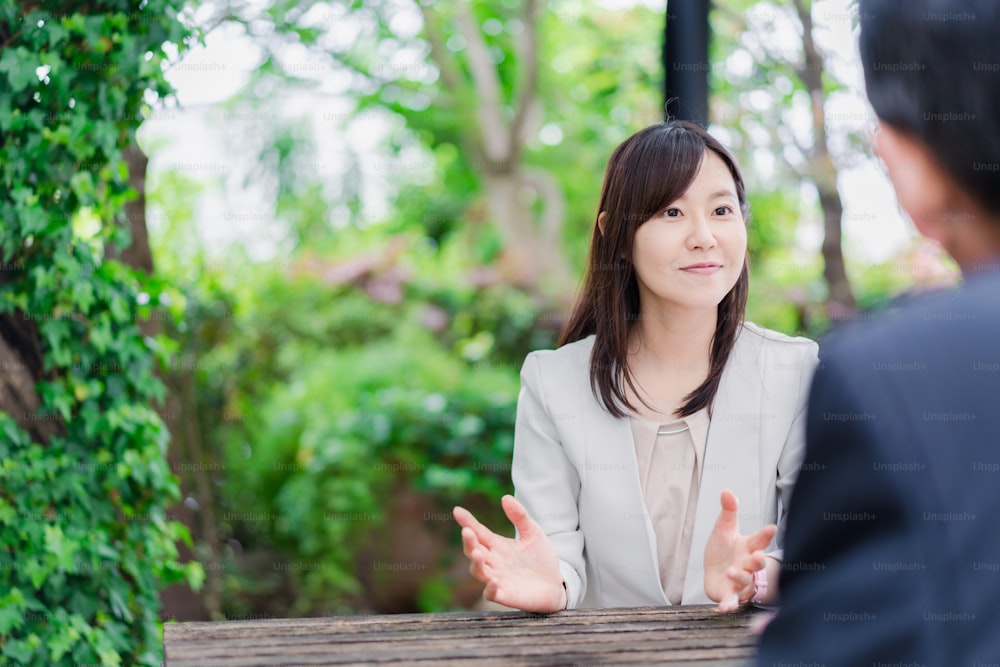 Businesswoman exchanging opinions outdoors