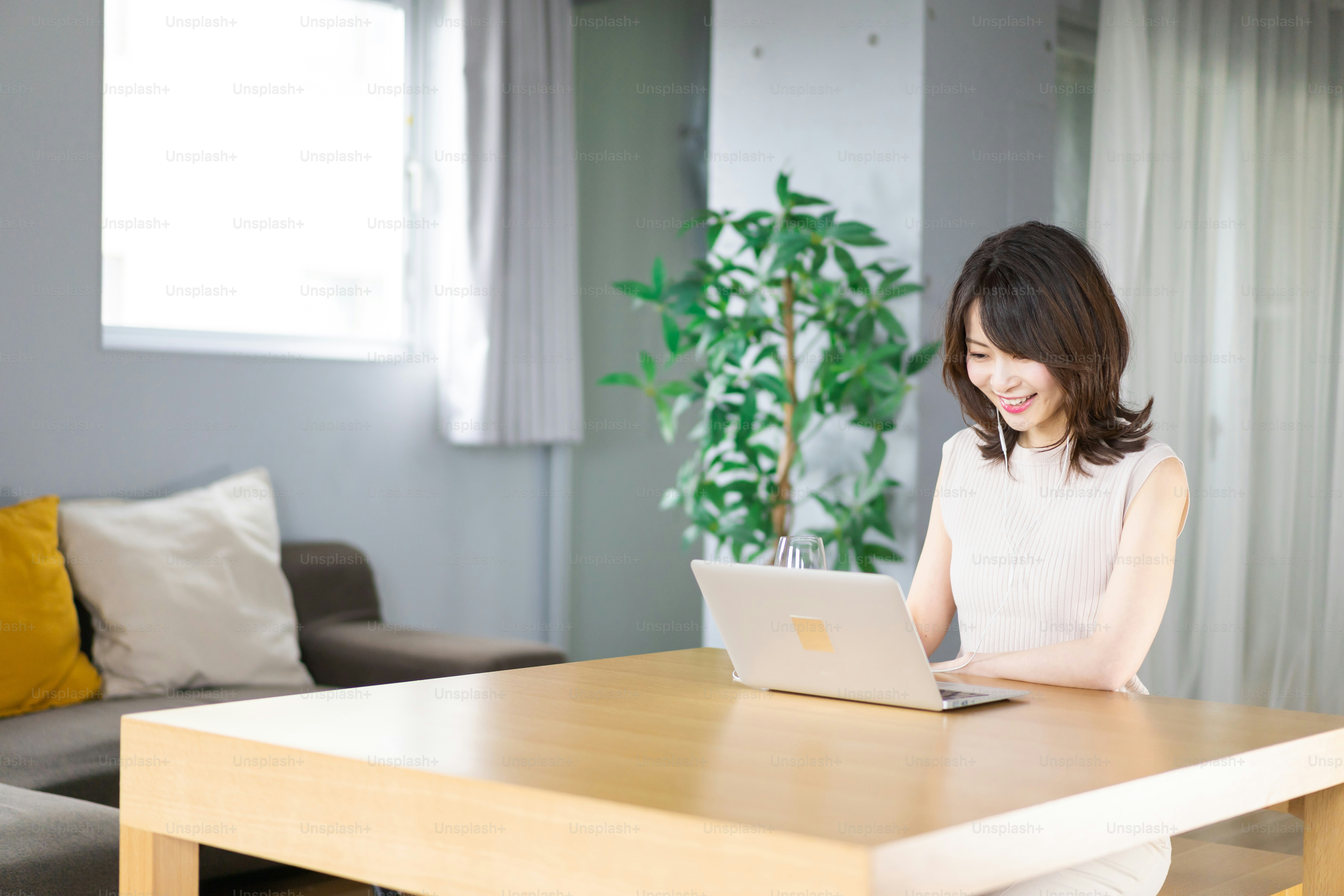 A young woman participating in an online drinking party