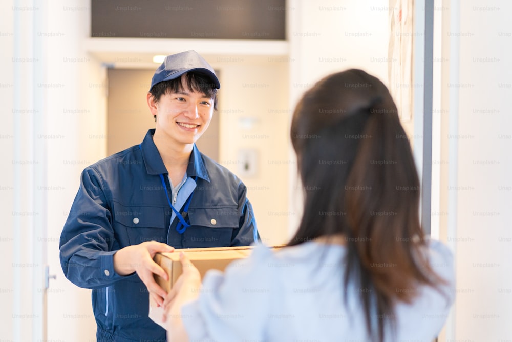 Young woman receiving a parcel delivery