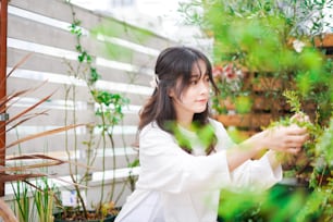 A young woman gardening in the garden