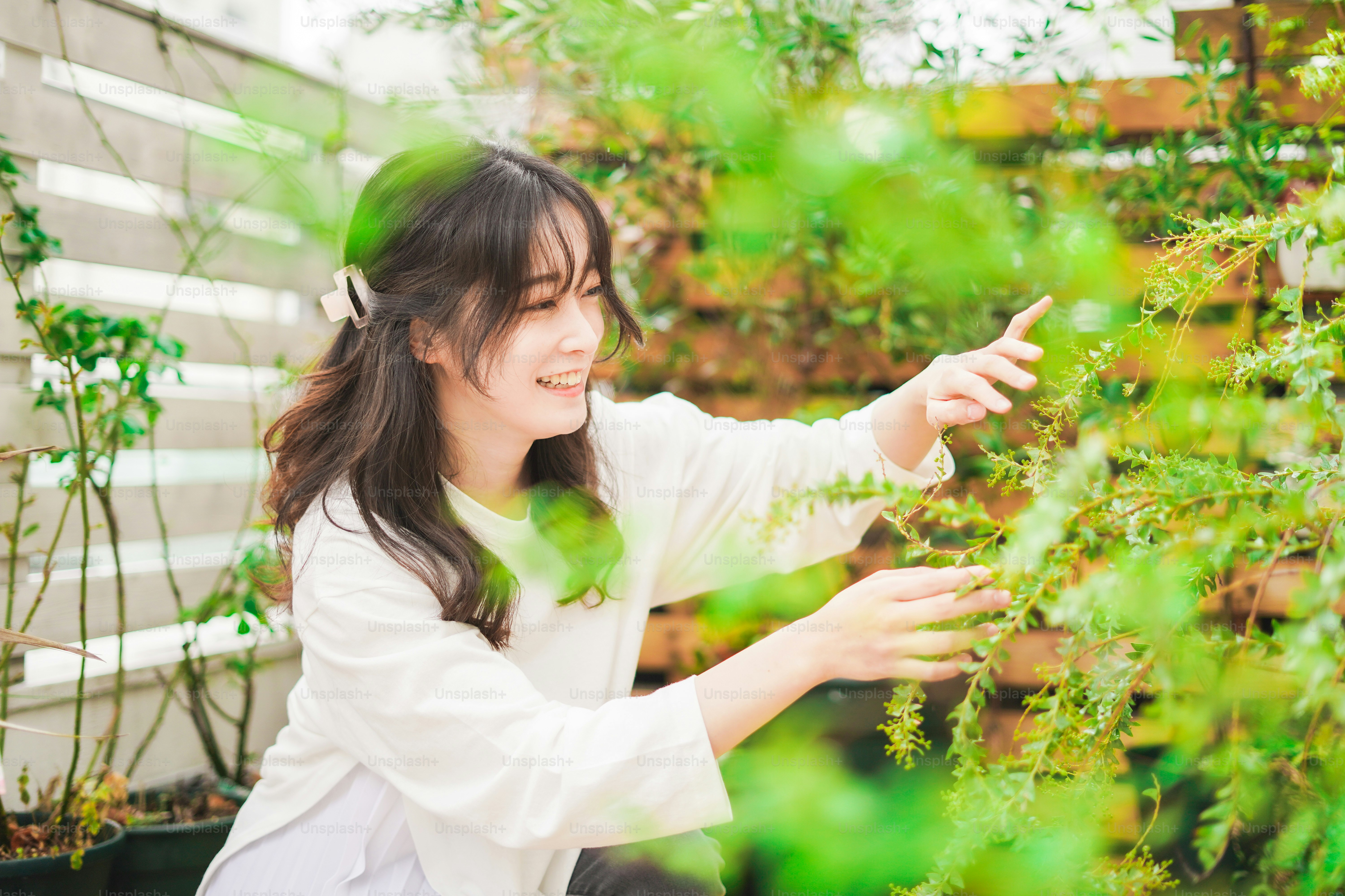 A young woman gardening at home