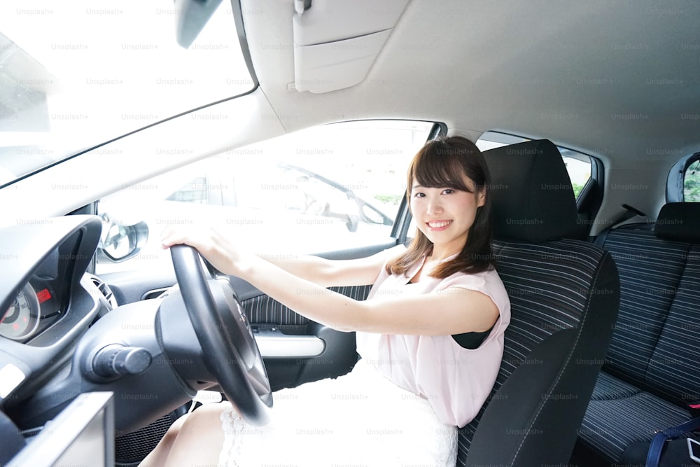 Young woman driving a car