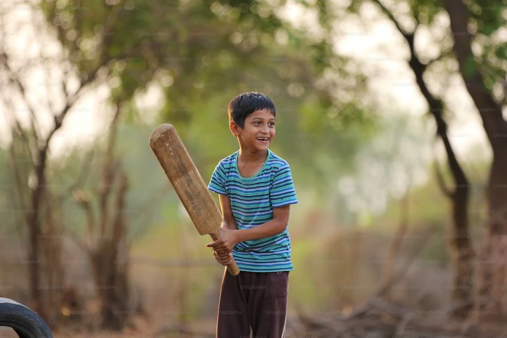 Rural Indian Child Playing Cricket