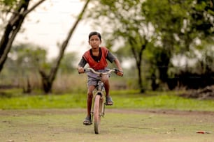 indian child on bicycle