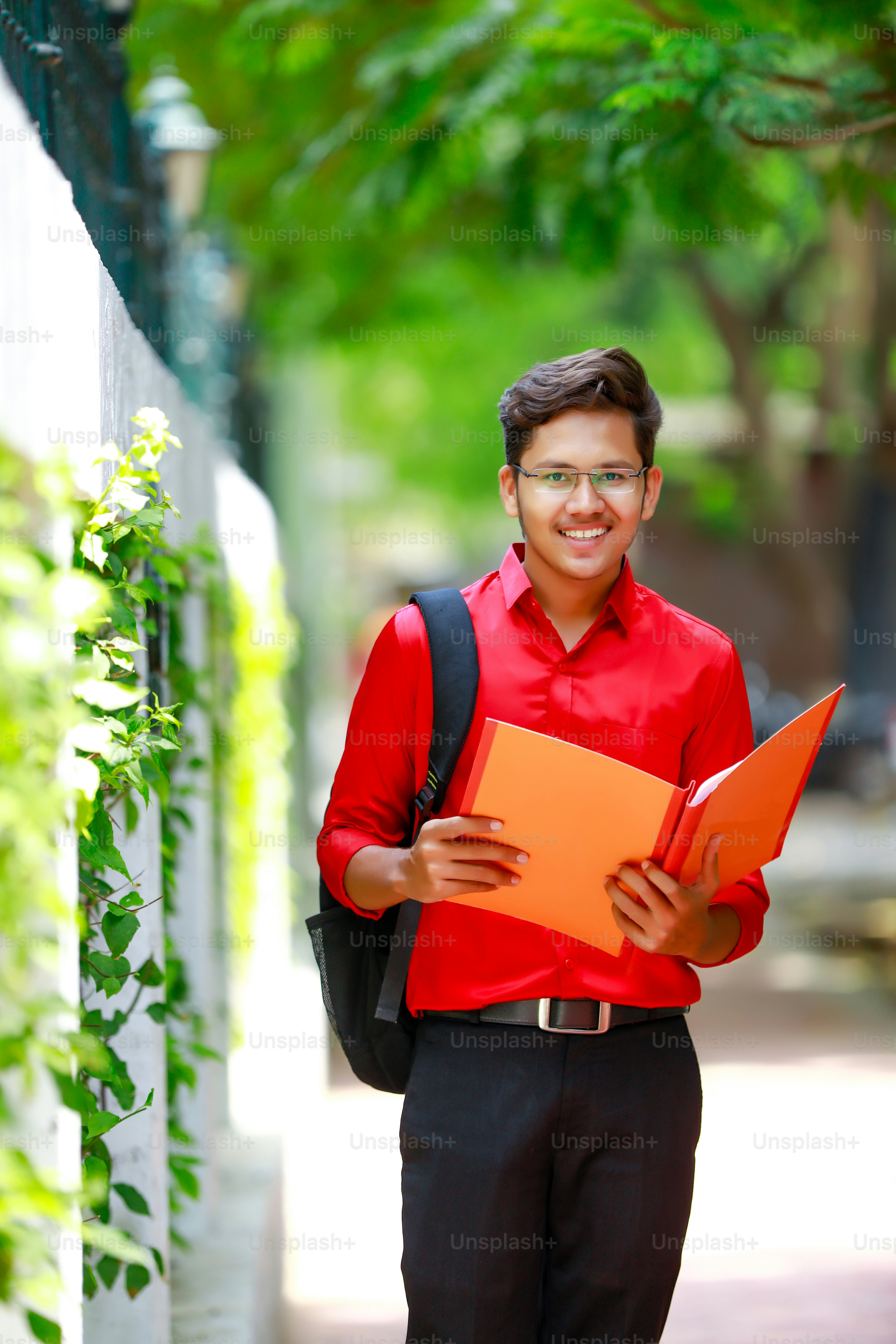 College Boy holding with file in hand
