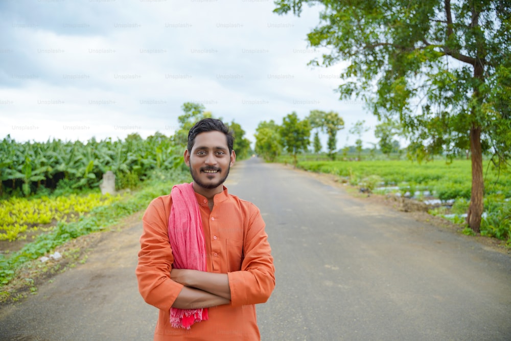 Indian farmer in traditional wear over nature background