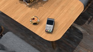 a cell phone sitting on top of a wooden table