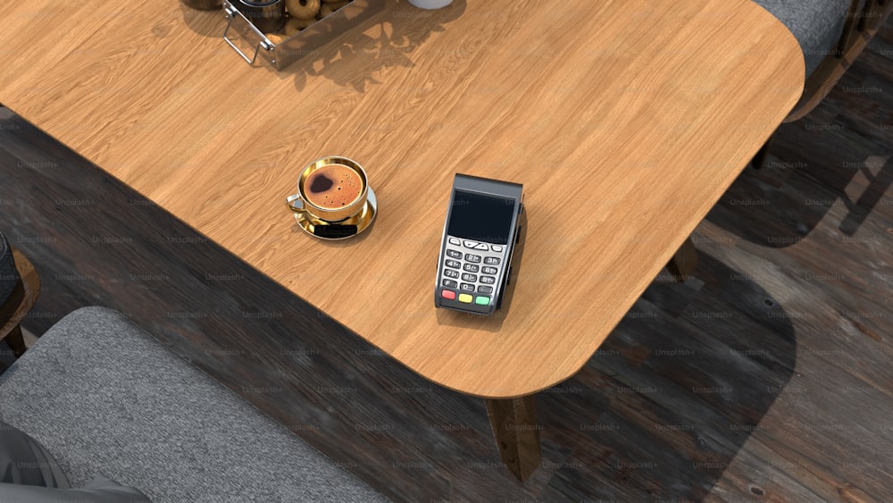 un telefono cellulare seduto sopra un tavolo di legno