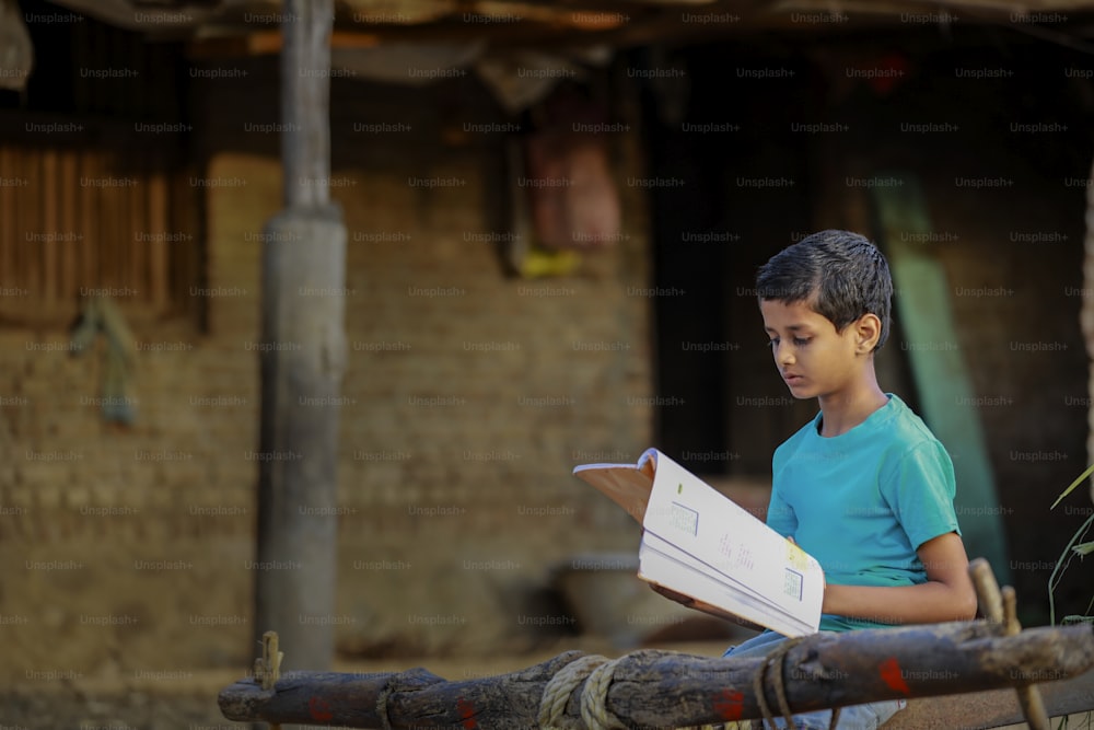 Cute indian child studying at home