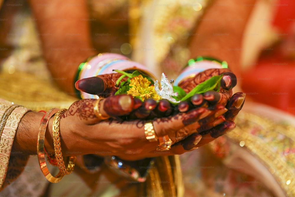 Traditional indian wedding ceremony, groom and bride hand