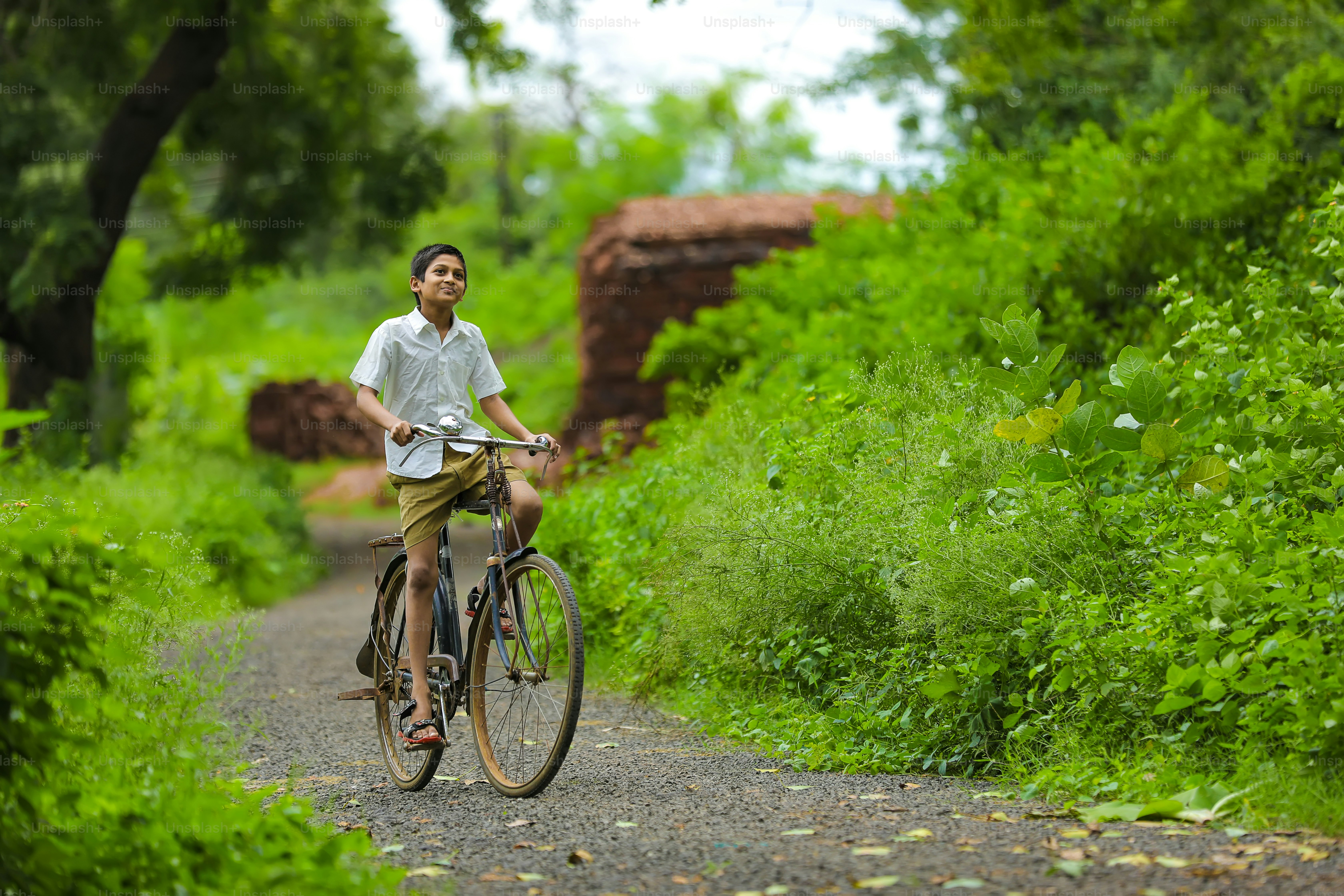 indian little boy enjoy cycle riding